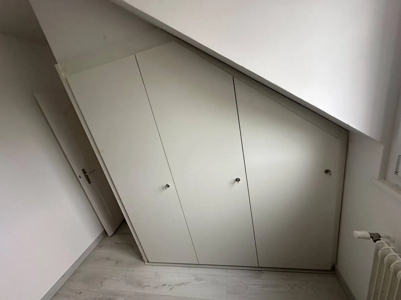 Bespoke wardrobe under the eaves, three doors