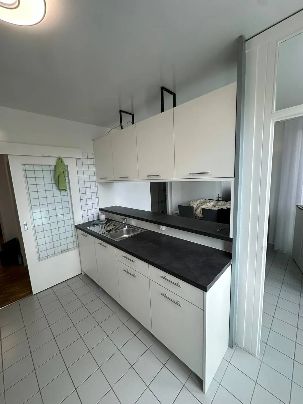 Bespoke kitchen with black worktop and sink