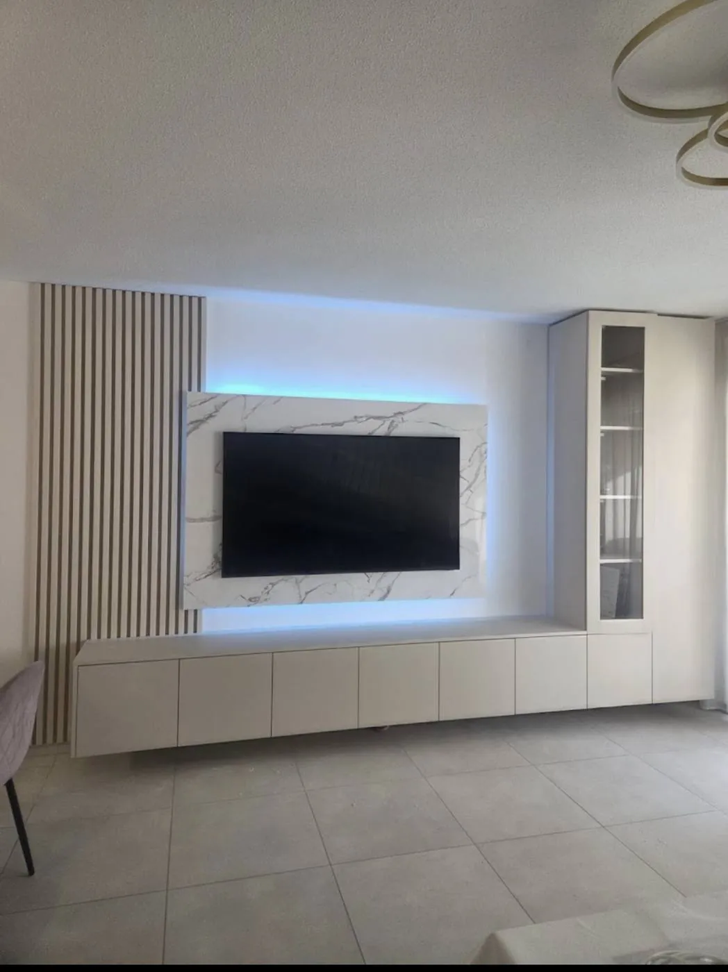 Bespoke TV unit with marble cladding and display cabinet
